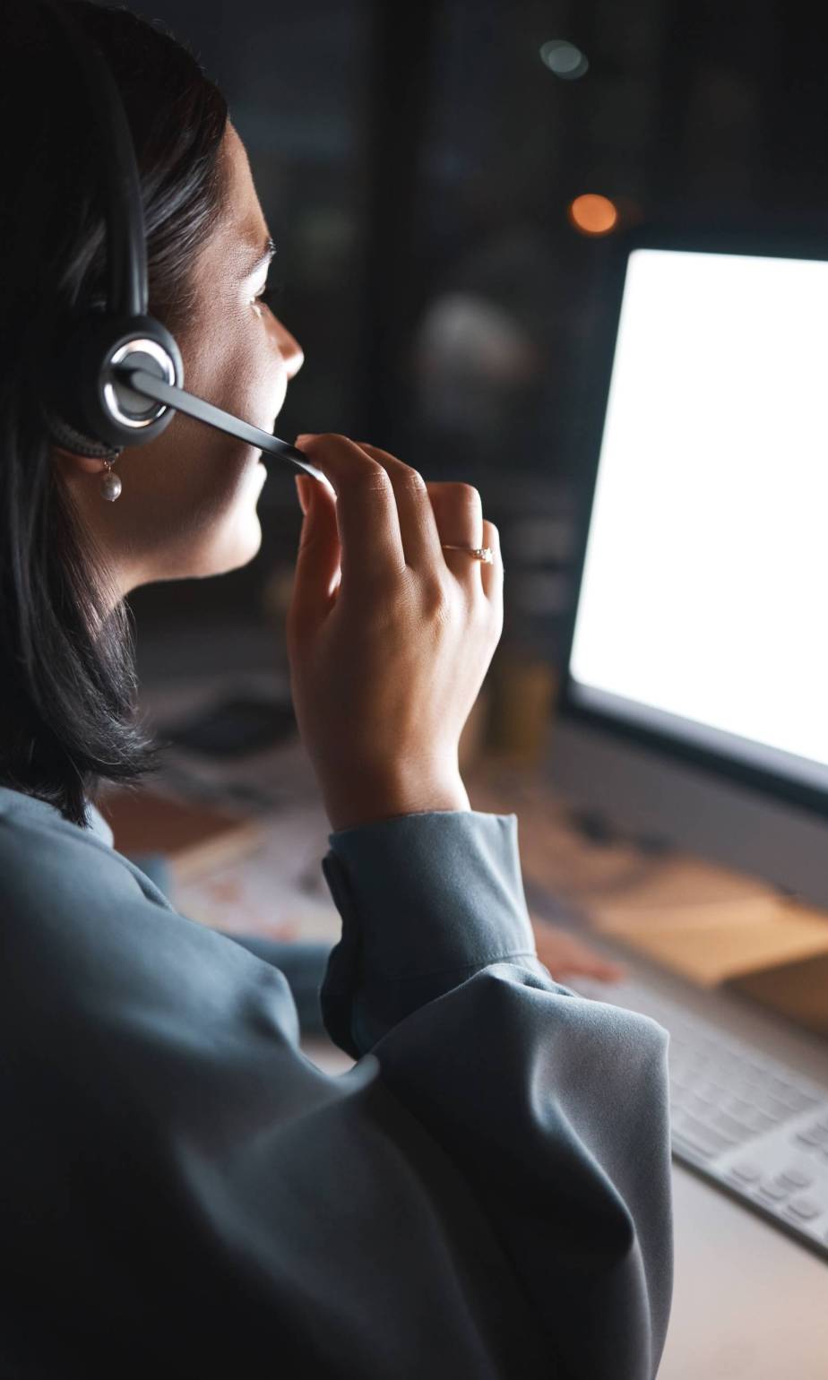 Business woman, consultant and call center in telemarketing, customer support or service for night at the office. Female employee agent in consultation, advice or hotline working the late shift.